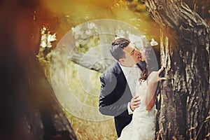 Sensual married couple in forest