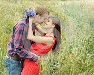 Sensual outdoor portrait of young smiling attractive couple in l
