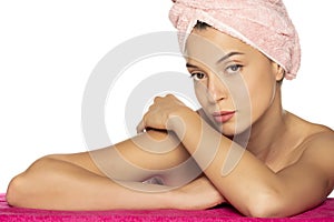 Sensual portrait of beautiful young woman with towel on her head