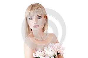 Sensual portrait of a blond woman with flowers