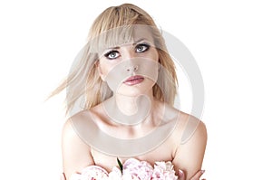 Sensual portrait of a blond woman with flowers.