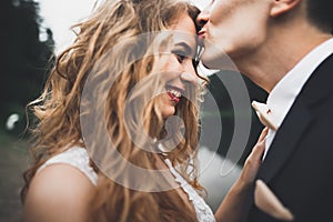 Sensual portrait of a young wedding couple. Outdoor