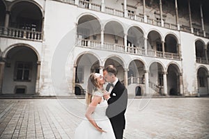 Sensual portrait of a young wedding couple. Outdoor