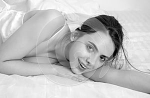 Sensual portrait of young woman in bed. Beautiful girl model.