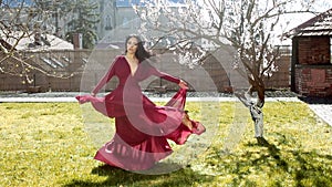 Sensual spring girl. Woman in flower park, rose garden. Nature beauty.