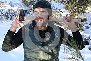 Sensual strong man holding an axe