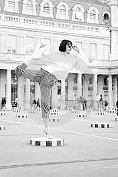 Sensual woman with brunette hair. Woman pose on high heel shoes in paris, france. Beauty girl with glamour look. Fashion