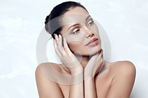 Sensual woman with dark hair with radiance healthy skin