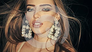Sensual woman. Sparkle Makeup. Close up of beauty fashion girl with silver rhinestones lipstick and glitter