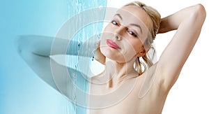 Sensual woman under water splash over white background.