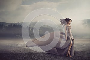 Sensual woman walking on the fantasy ground