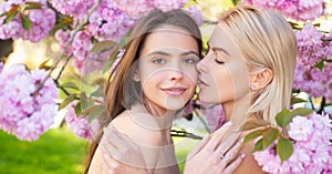 Sensual woman spring outdoor portrait banner. Portrait of a two beautiful spring girls. Two young women relaxing in