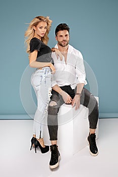 Sensual young couple posing wearing jeans