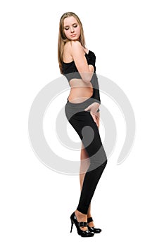 Sensual young woman in skintight black costume photo