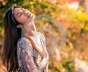 Sensuality beautiful woman is receiving sunlight on the beach side for Vacation and Relaxation cocnept photo