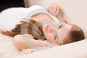 Sensuality woman lying on a sofa photo