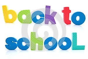 Sentence Back to school in colorful foam letters photo