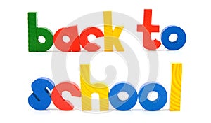 Sentence Back to school in wooden colorful letters photo