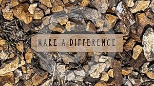 The sentence We believe in making a difference was written. Wooden concept studio shoot