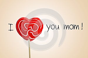 The sentence I love you mom with a heart-shaped lollipop