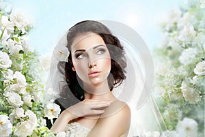 Sentiment. Perfect Exquisite Woman with Flowers over Vernal Floral Background