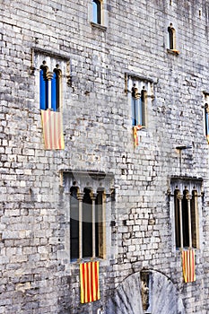 The Senyera Flag of Catalonia displayed outside windows