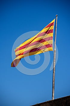 Senyera - Flag of Catalonia waving in the wind