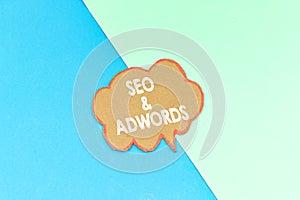 Seo and adwords speech bubble isolated on pink and blue background