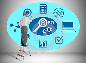 Seo concept drawn by a man on a ladder