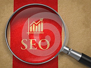 SEO through Magnifying Glass. Internet Concept.