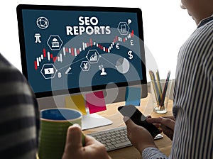 SEO REPORTS Concept Business team hands at work with financial r