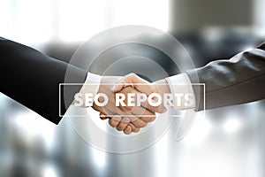 SEO REPORTS Concept Business team hands at work with financial r