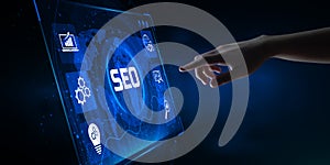 SEO Search engine optimisation digital internet marketing concept. Hand pressing button on screen