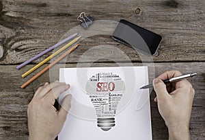 SEO (search engine optimization) bulb word cloud