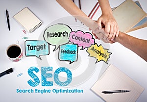 SEO Search Engine Optimization concept. The meeting at the white office table