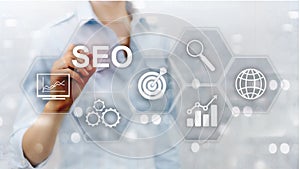 SEO - Search engine optimization, Digital marketing and internet technology concept on blurred background.