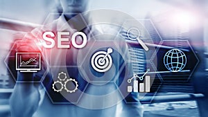 SEO - Search engine optimization, Digital marketing and internet technology concept on blurred background.