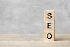 SEO Search Engine Optimization text wooden cube blocks on table background. Idea, Strategy, advertising, marketing, Keyword and