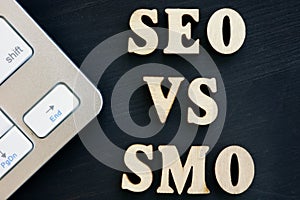 SEO vs SMO and keyboard on a dark desk photo