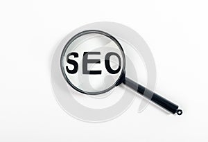 SEO word, acronym through magnifying glass