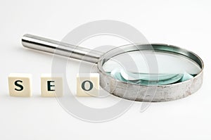 SEO word and magnifying glass