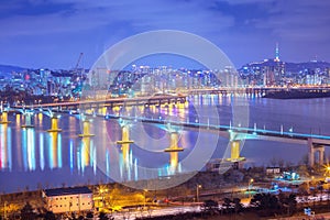 Seoul city and Cars passing on The bridge and Traffic, Han River at Night in Downtown Seoul, South Korea