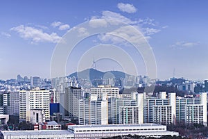 Seoul cityscapes with high rise office buildings and skyscrapers in Seoul city, Republic of Korea in winter blue sky and cloud