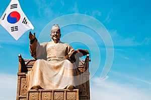 The statue of King Sejong with Korean national flag Taegeukgi in Seoul, Korea