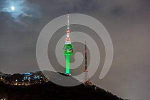 Seoul Tower with full moon on Namsan Mountain