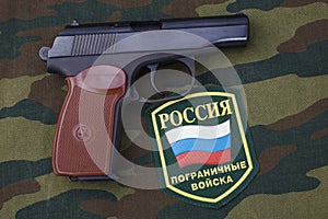 Sep. 21, 2017. Russian border guards uniform badge with handgun Makarov on camouflage uniform