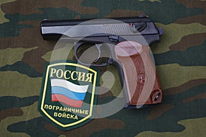 Sep. 21, 2017. Russian border guards uniform badge with handgun Makarov on camouflage uniform