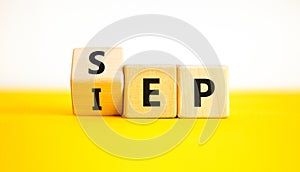 SEP or IEP symbol. Concept words IEP initial enrollment period SEP special enrollment period. Beautiful yellow table white