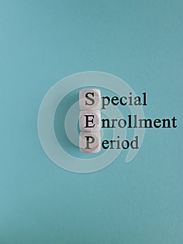 SEP special enrollment period symbol. Concept words SEP special enrollment period on wooden cubes