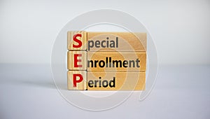 SEP, special enrollment period symbol. Wooden blocks with words `SEP, special enrollment period`. Beautiful white background, co